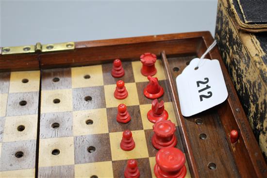 A late 19th century Jaques, London Travelling In Statu Quo travelling chess set, the original leather case containing a boxwood